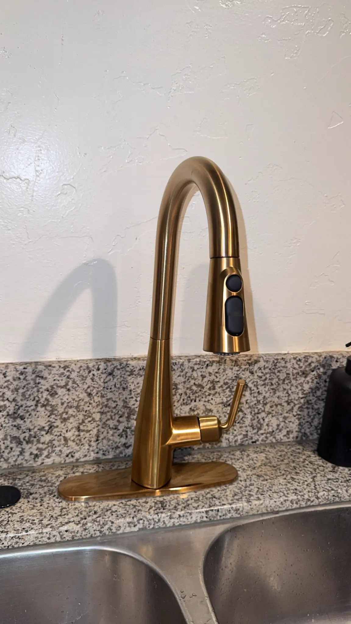 Kitchen faucet service completed on a granite countertop by CCS Plumbing Inc.